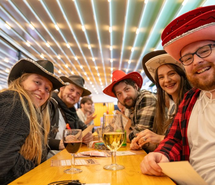 Staff taking a selfie at a table in our country bash social