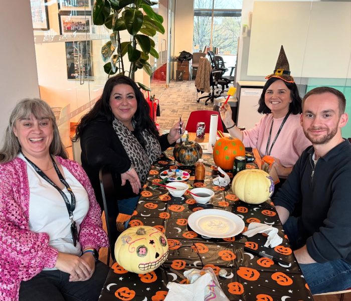 Staff making decorations together for halloween