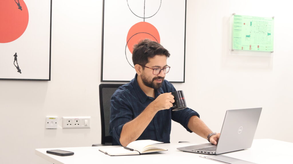 A member of our team enjoying a coffee while working
