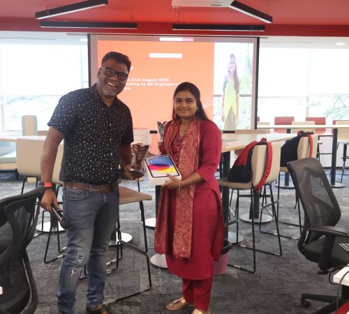 A photo of Kishore and a member of our team celebrating a collective employee work anniversary