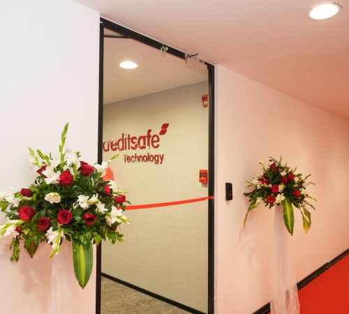 A photo of our office's reception door with a ribbon around it for our company's initial opening day celebration!